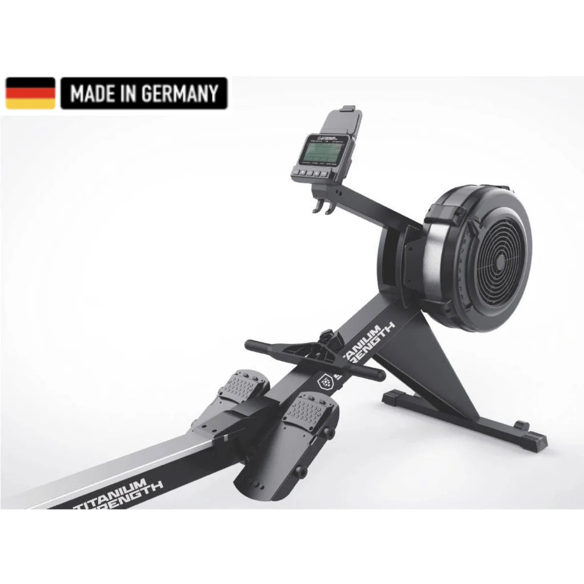 Titanium Strength rowing machine featuring a sleek black design with a built-in digital console, foot pedals, and a durable flywheel. A 'Made in Germany' badge is displayed in the top left corner.