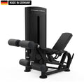 A sleek, black Titanium Strength gym machine with padded leg supports and adjustable features, labeled 