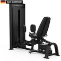 A leg exercise machine with padded seat and adjustable foot platform. Black design with 