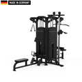 Multi-functional black gym machine with various attachments, including a cable pulley system, adjustable weight stacks, a seated row station, and a Smith machine bar. The equipment is labeled 