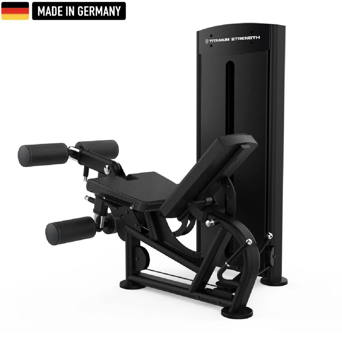 A sleek, black Titanium Strength gym machine with padded leg supports and adjustable features, labeled "Made in Germany."