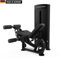 A sleek, black Titanium Strength gym machine with padded leg supports and adjustable features, labeled 