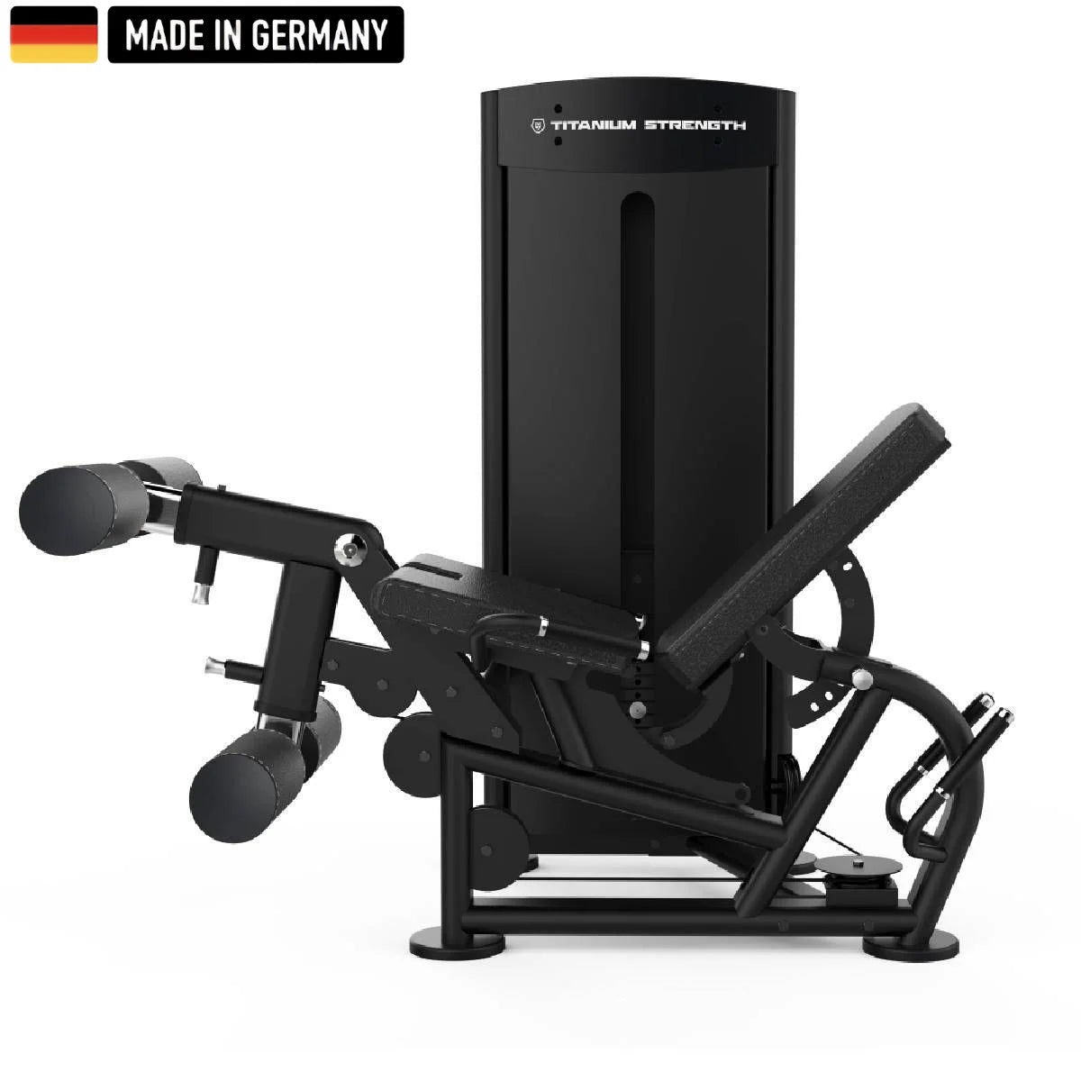 A sleek, black Titanium Strength gym machine with padded leg supports and adjustable features, labeled "Made in Germany."