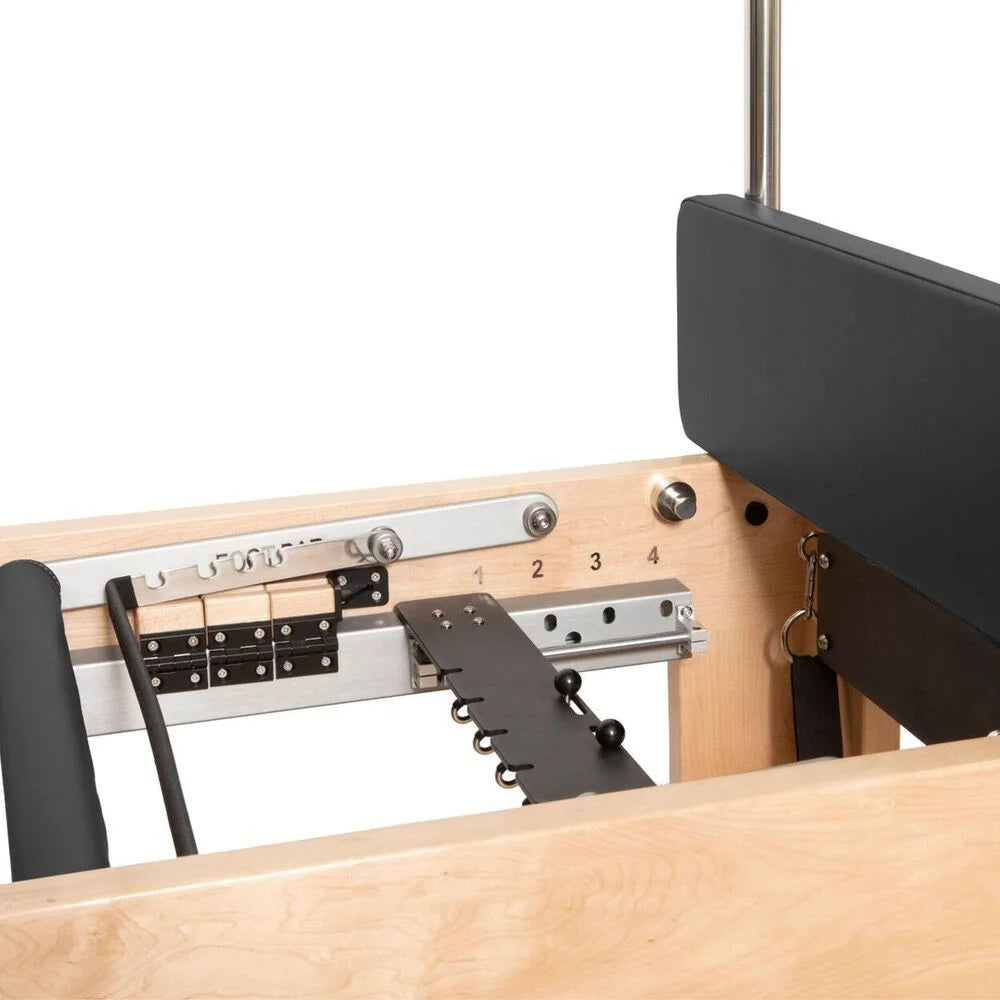 Close-up view of the back of a Pilates machine, showcasing its structure and design features.