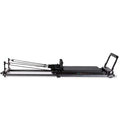 Elina Pilates Domo Reformer – compact, foldable Pilates reformer made of aluminum with adjustable footboard and transport wheels.
