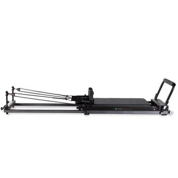 Elina Pilates Domo Reformer – compact, foldable Pilates reformer made of aluminum with adjustable footboard and transport wheels.
