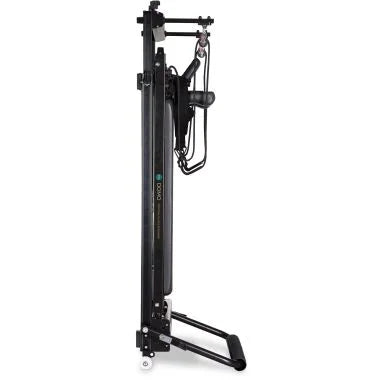 Elina Pilates Domo Reformer – compact, foldable Pilates reformer made of aluminum with adjustable footboard and transport wheels.
