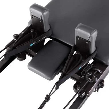 Elina Pilates Domo Reformer – compact, foldable Pilates reformer made of aluminum with adjustable footboard and transport wheels.

