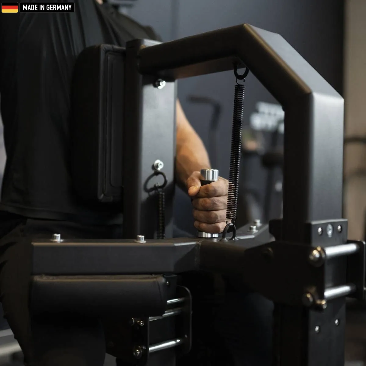 Elite Series Isolateral Lat Pulldown machine by Titanium Strength in a modern gym environment