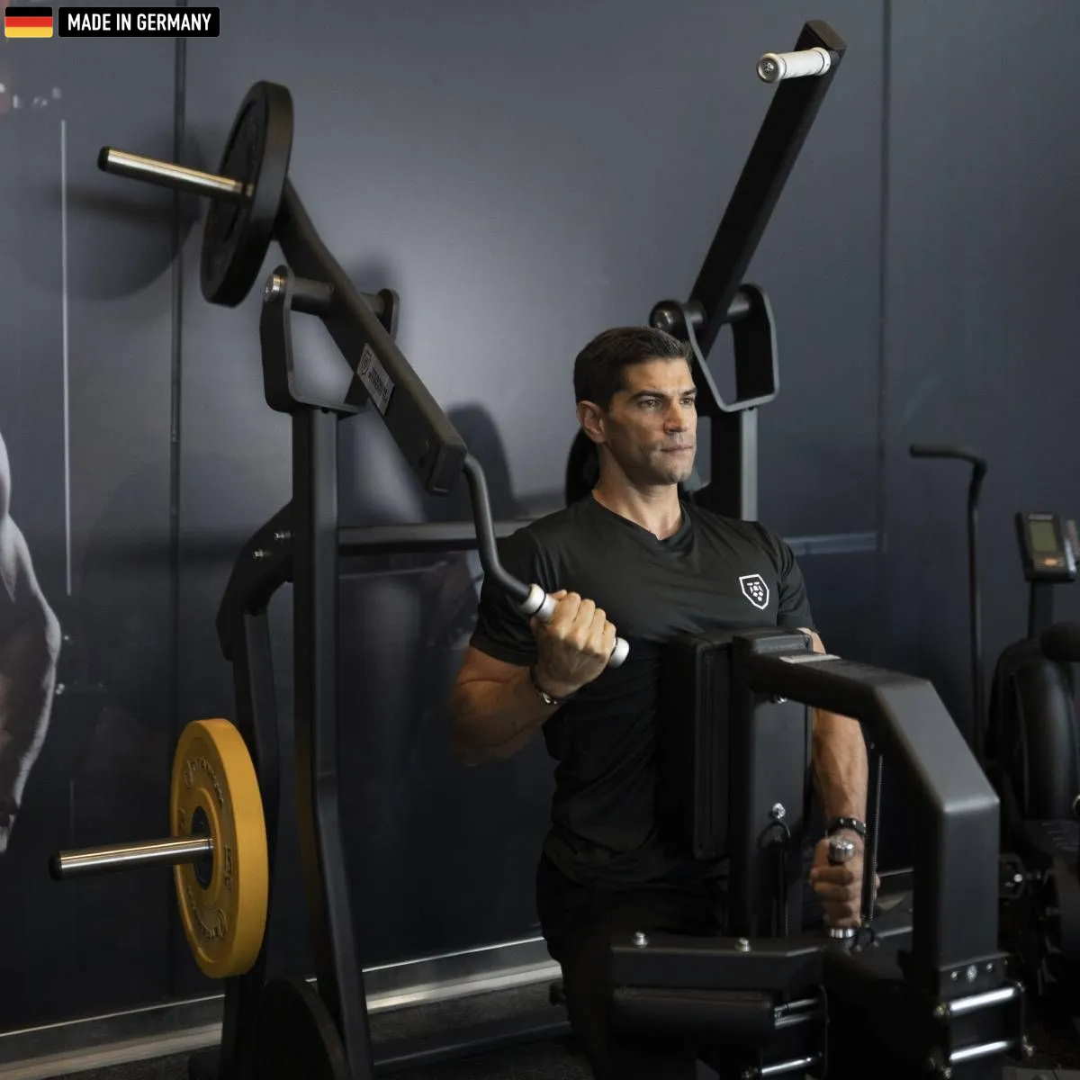 Elite Series Isolateral Lat Pulldown machine by Titanium Strength in a modern gym environment